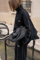 Zwarte joggings set met reflecterende strepen op zijkant van naetur